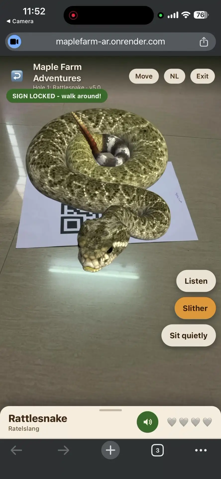 Rattlesnake coiled on a printed QR sign in augmented reality, with a green Sign Locked badge showing the anchor is holding