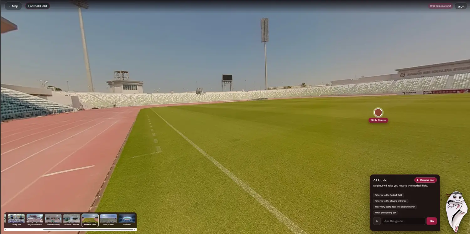 On the pitch at Hamad bin Khalifa Stadium with the AI avatar guide answering the visitor in the guide panel